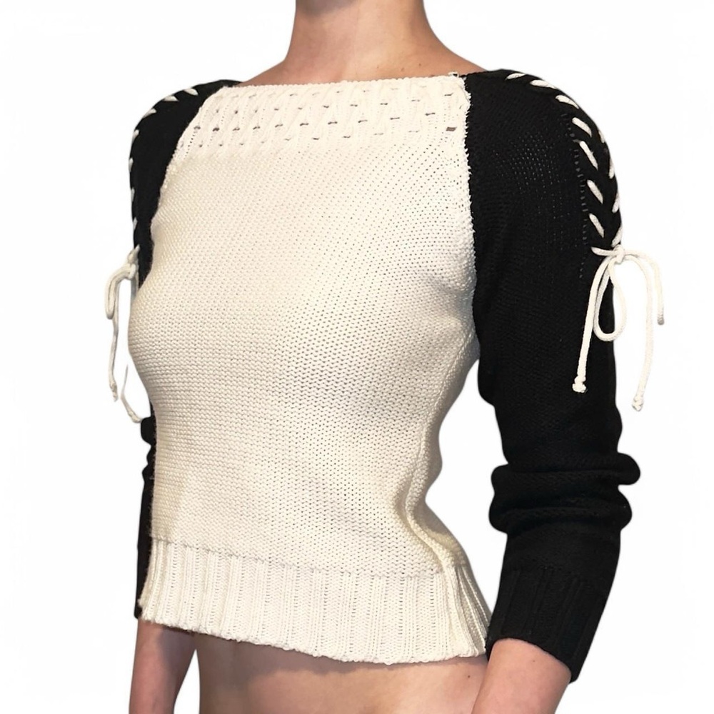 Cream and black sweater with lace up detailing on sleeves